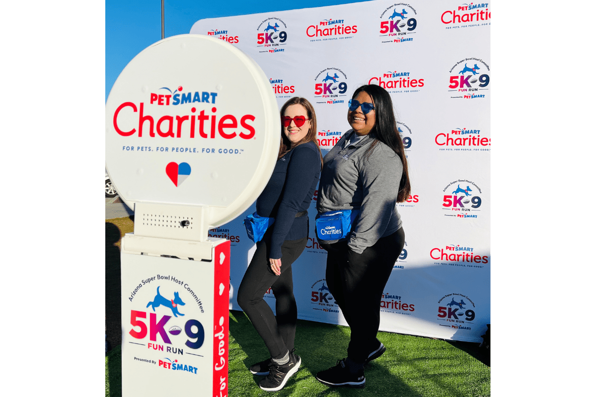 Corporate guests posing at an outdoor MISGIF Photo Booth activation during the PetSmart Charities 5K9 Fun Run in Phoenix Arizona, highlighting expert outdoor photo booth rental tips for corporate events, nonprofit activations, and brand experiences in Arizona’s heat.